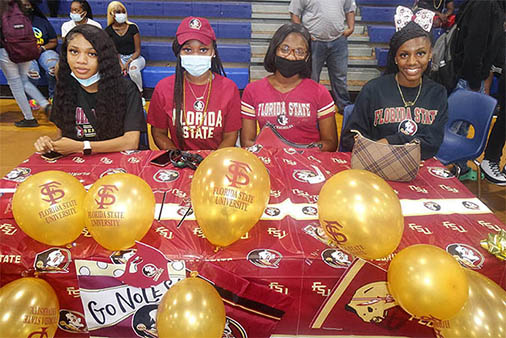 Students sitting at an FSU event.